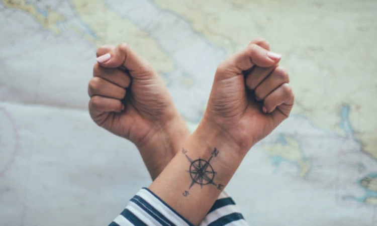 Compasses tattoo